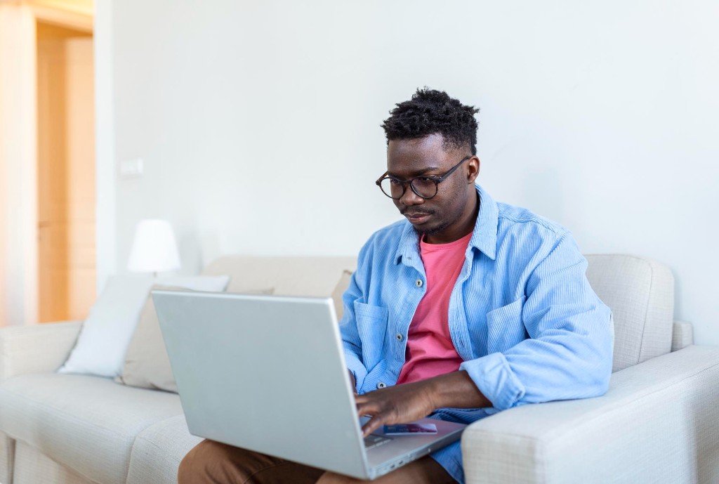 Man working on laptop at home